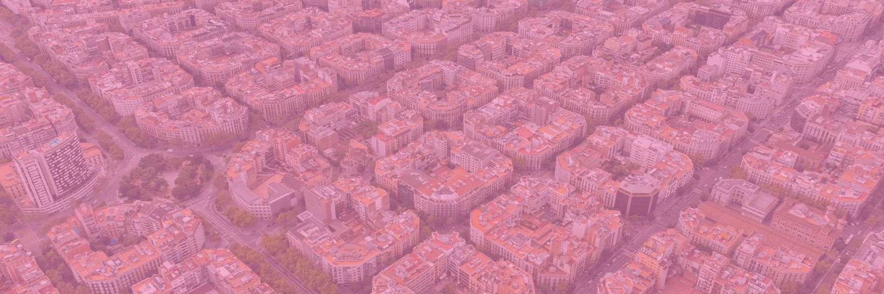 Aerial view of densely packed city blocks, representing the broad reach and interconnectedness of content marketing for law firms